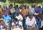 DISABLED REGAIN FREEDOM As Hon   Dr. Alyek Judith  Distributes Wheel Chairs In Kole